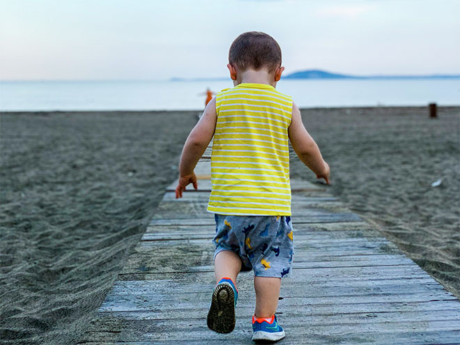 Leo running on the beach